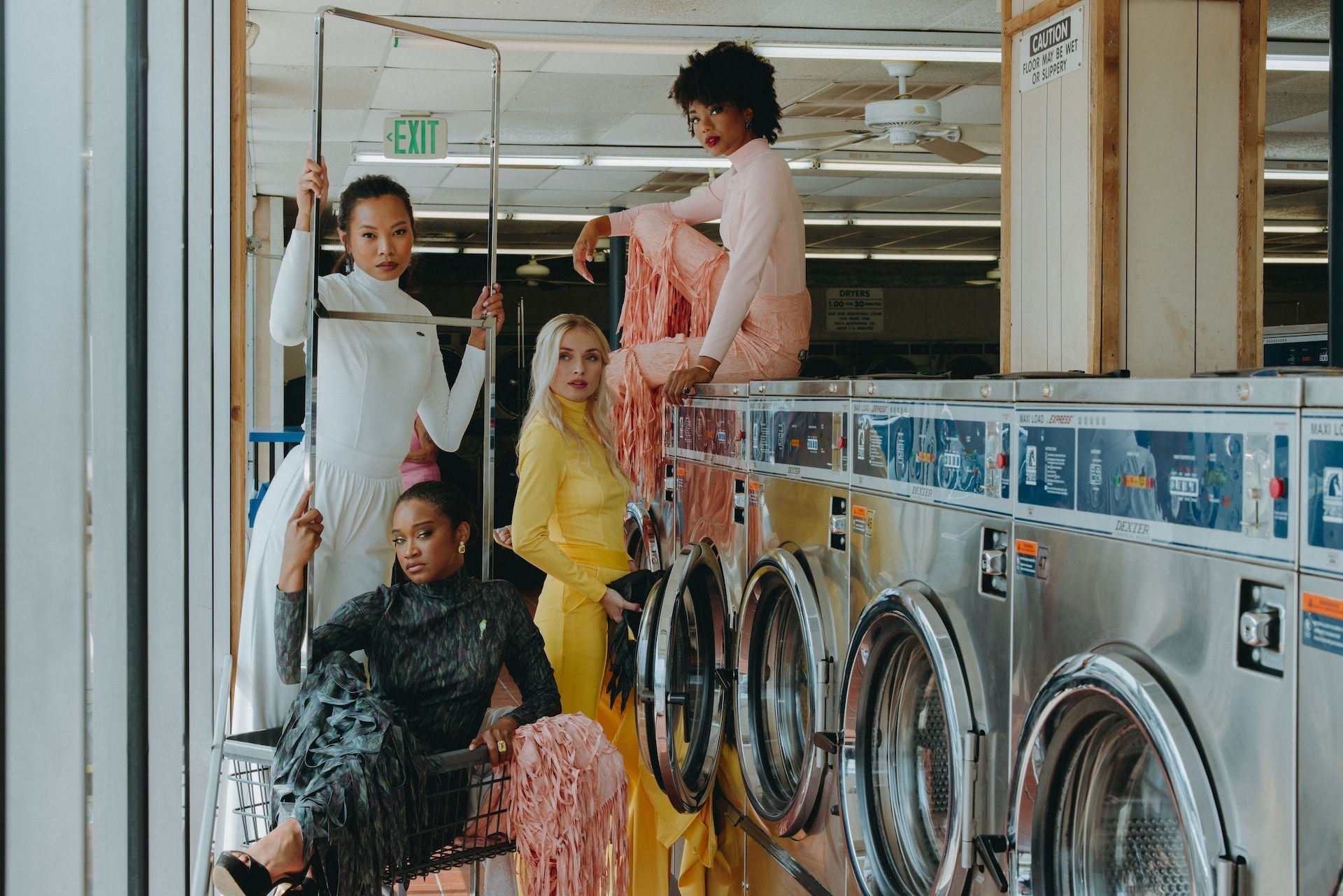 Models wearing Enza Marie, Dancing Anyone, Going Somewhere and Milano in a vintage laundromat.