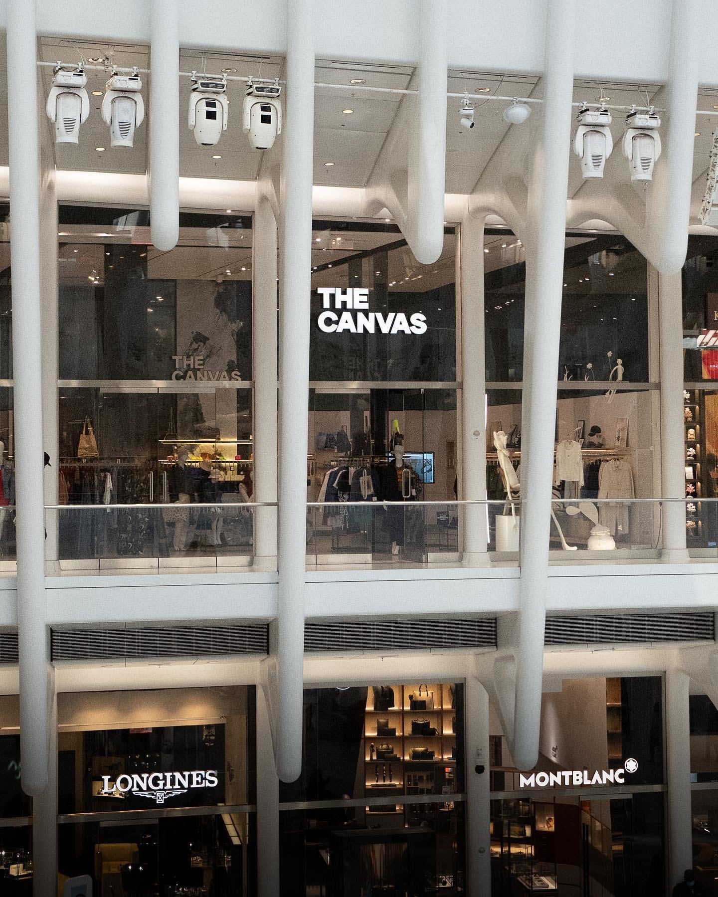 Exterior view of The Canvas storefront showcasing stylish apparel and accessories at The Canvas Oculus.