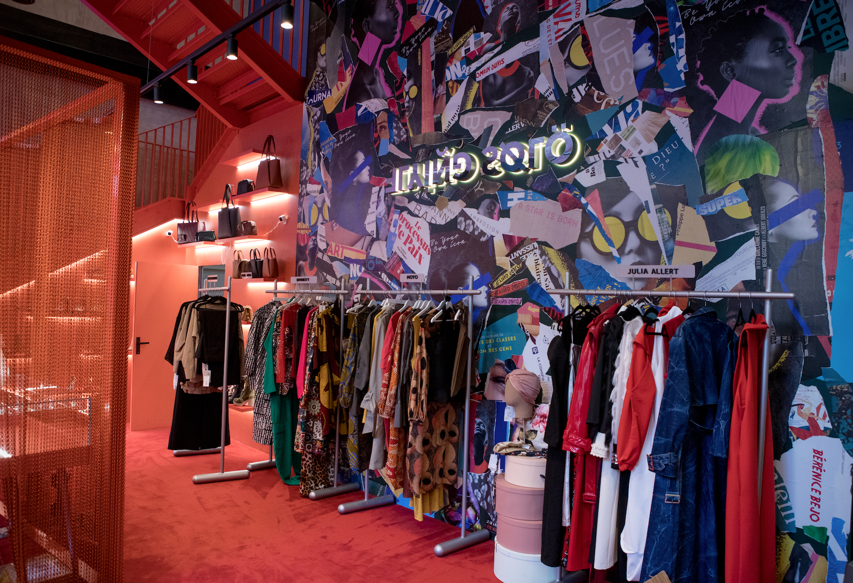 Flying Solo Paris - Fashion retail store interior featuring colorful clothing display against a vibrant wall collage.