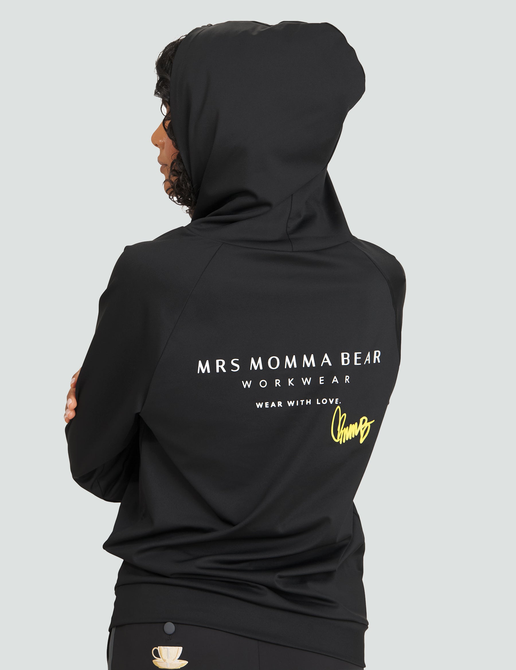 Unisex Original MMB Hoodie in black, showcasing the back design with "MRS MOMMA BEAR WORKWEAR" and "WEAR WITH LOVE."