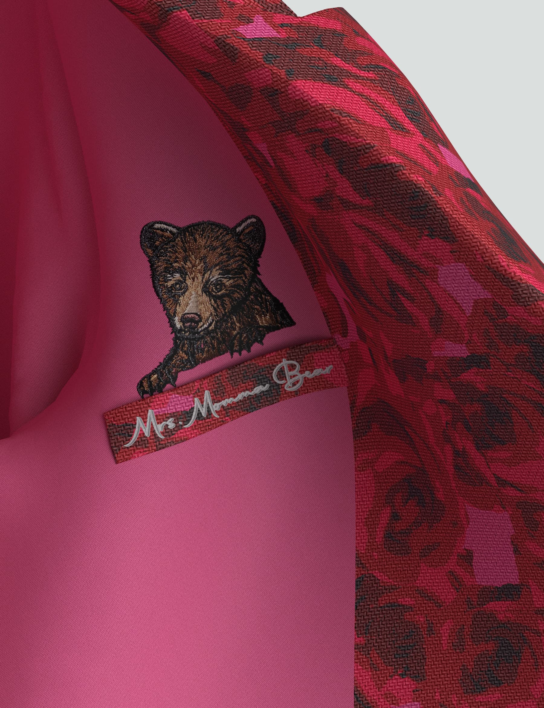 Inner label with bear logo and rose-patterned design from the Ruth Tuxedo Mini Dress.