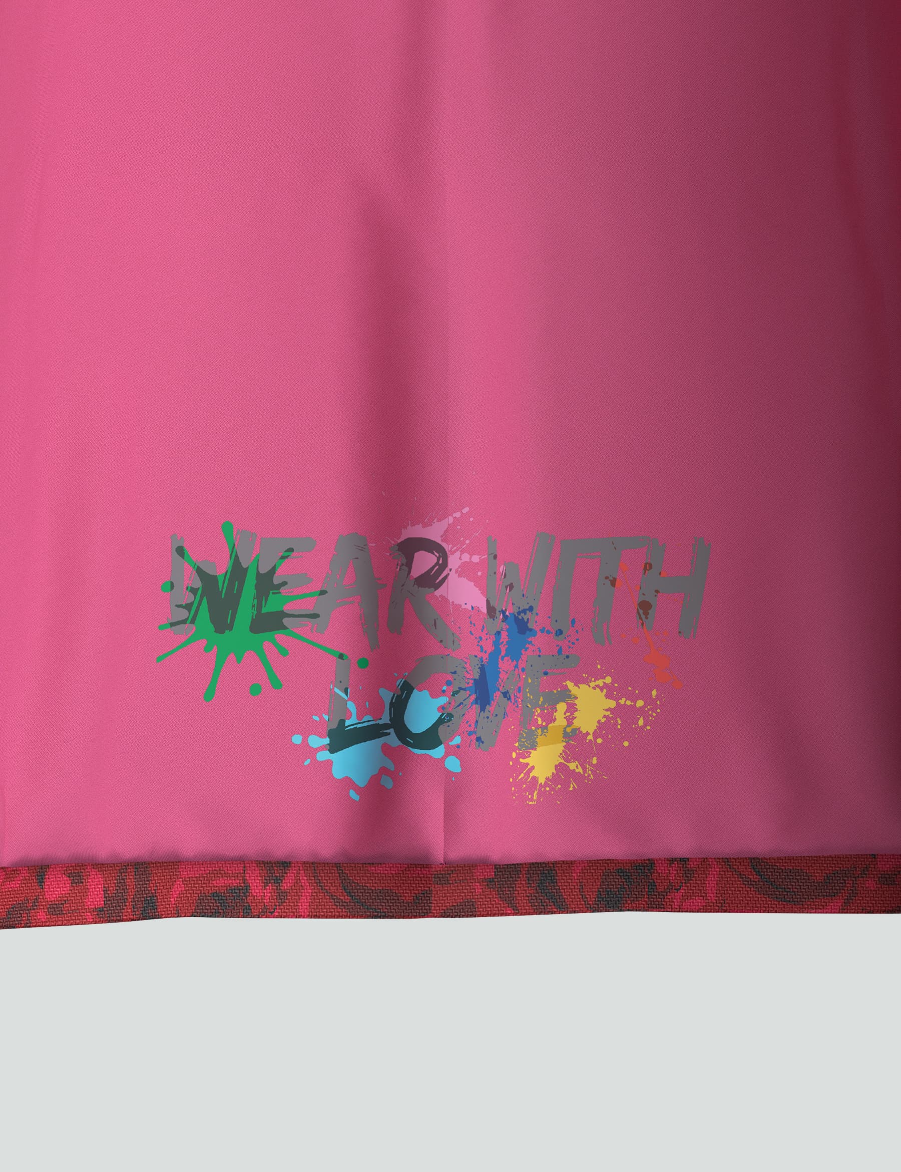 Pink fabric featuring the message "Wear with Love" in colorful, playful splashes. Ideal for promoting positivity and style.