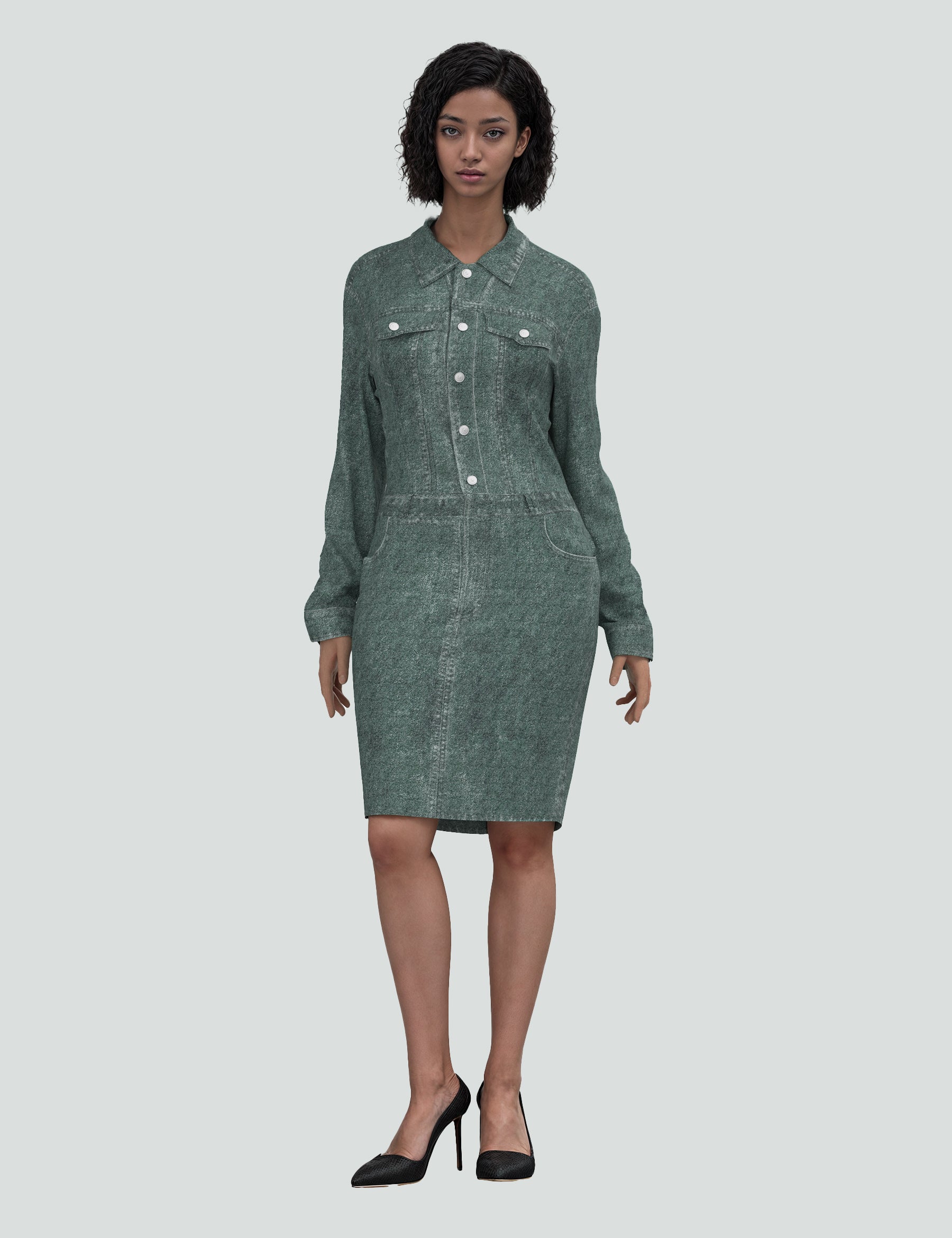 Model wearing a green denim-inspired mini dress with a button-up design and long sleeves.